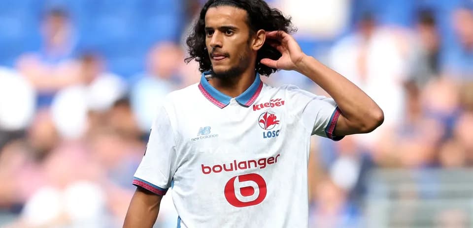 Player adjusting hair during match at stadium