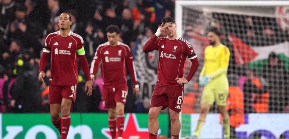 Liverpool players walking off field after match