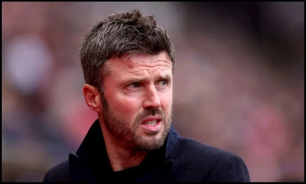 Man in black coat observing the football match