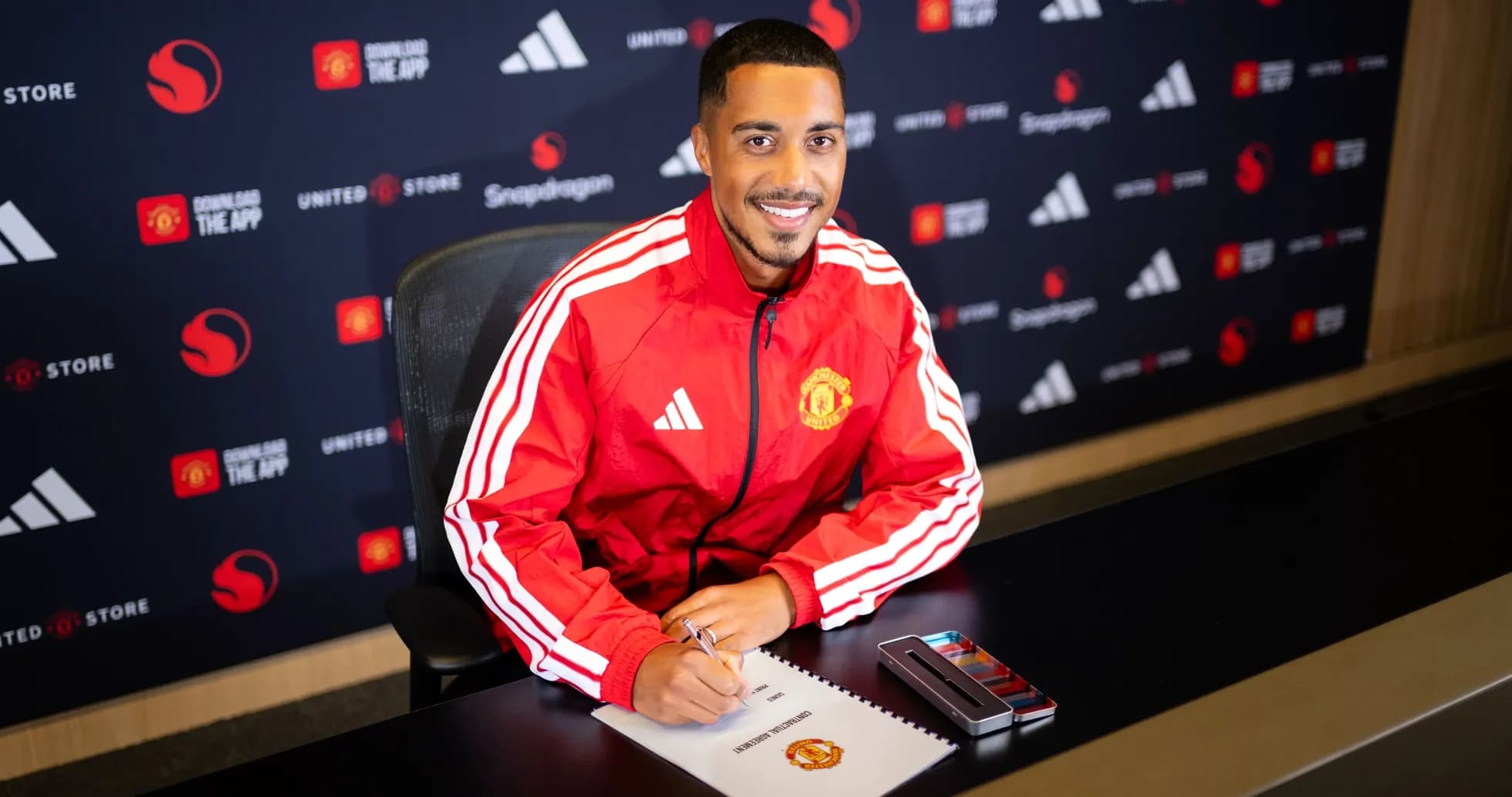 Player signing contract at Manchester United announcement
