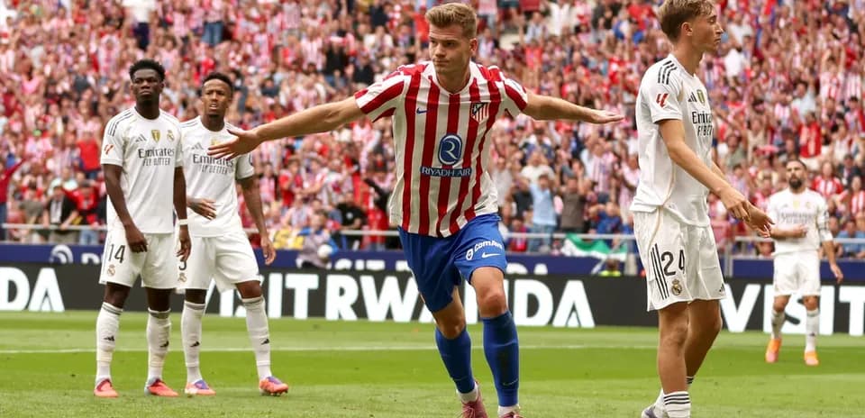 Atletico player celebrating goal against Real Madrid