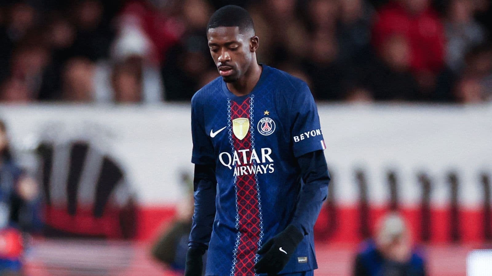 Player in PSG kit walking on the field