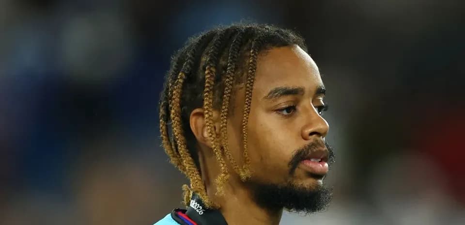 Player walking on the field with braided hair