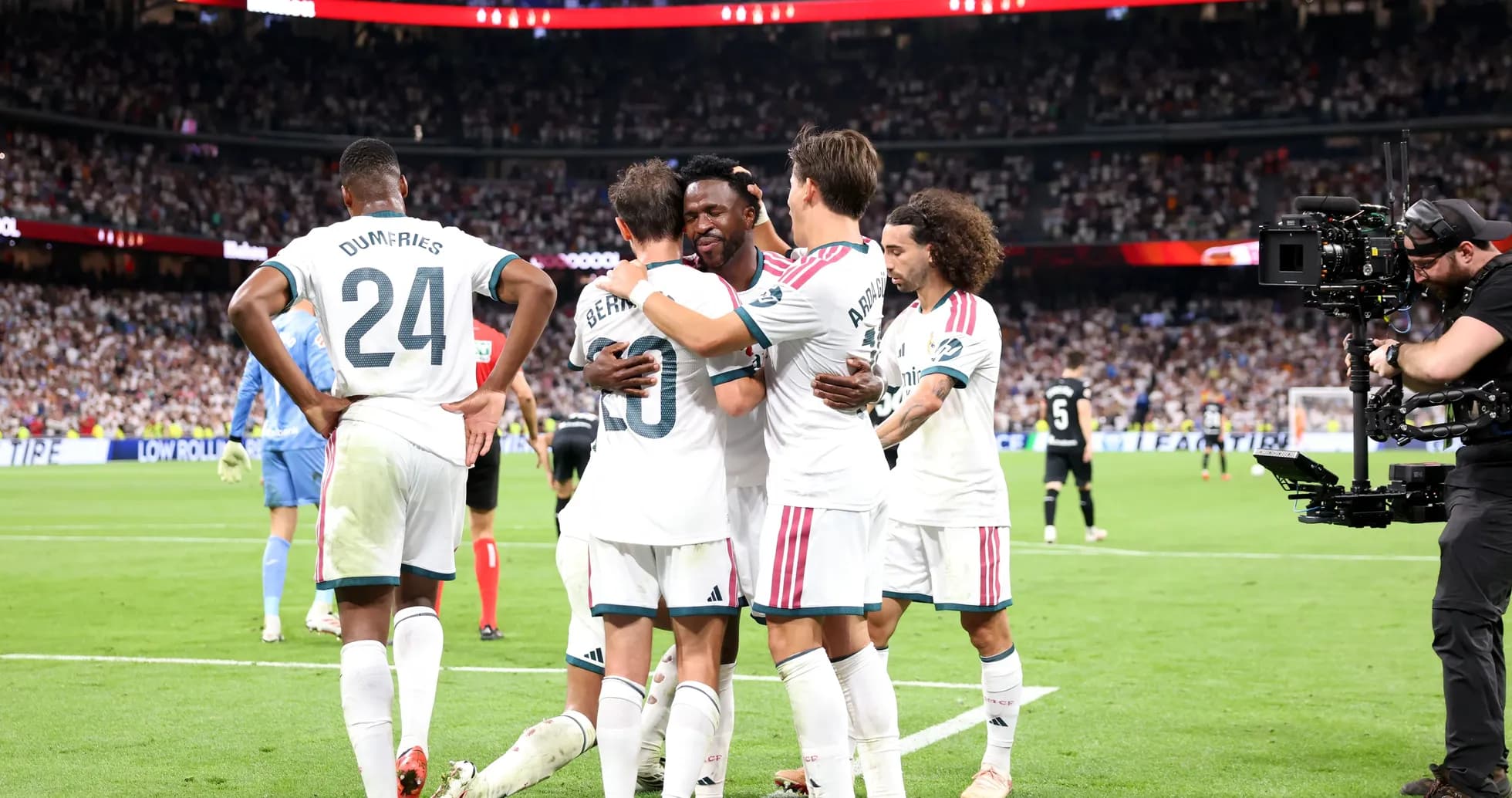 Players celebrating a goal during a match