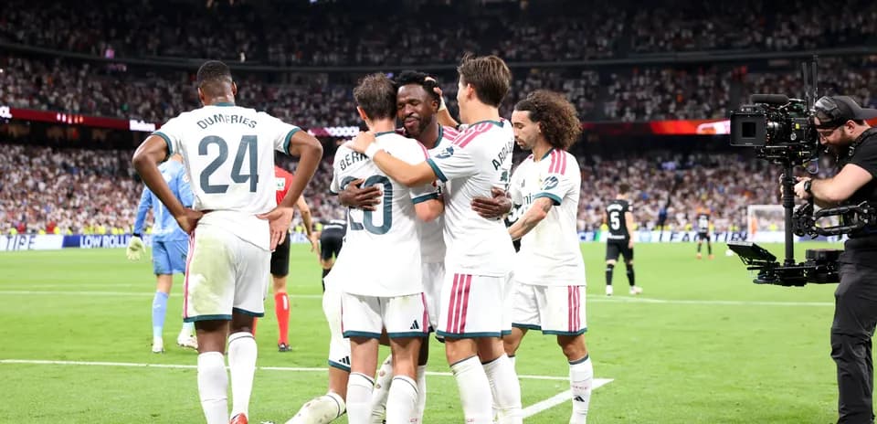 Players celebrating a goal during a match