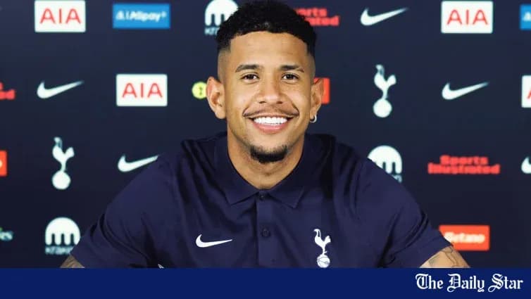 Player smiling at Tottenham Hotspur press conference