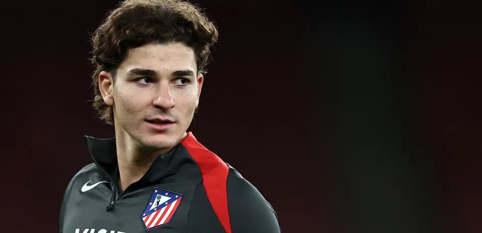 Player in Atlético Madrid training gear looking sideways