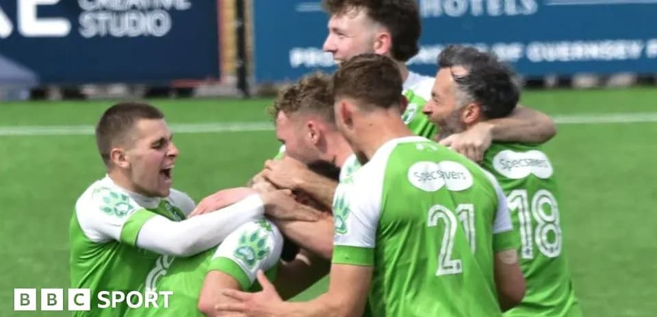 Players celebrating a goal on the pitch