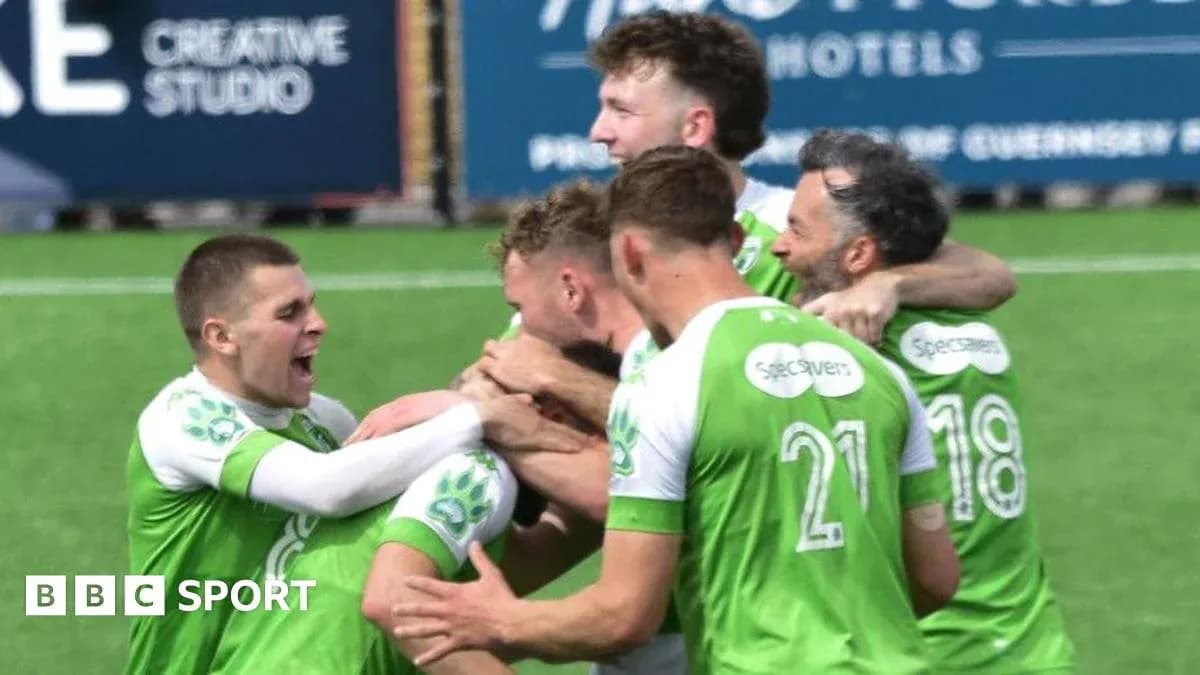Players celebrating a goal on the pitch