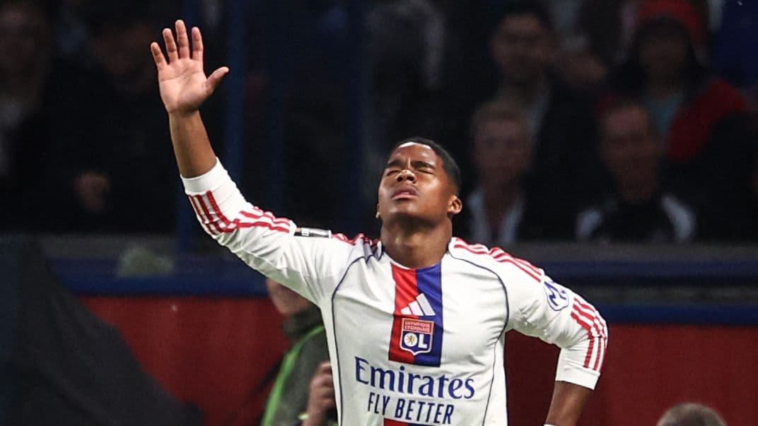 Player celebrating after scoring a goal for Lyon