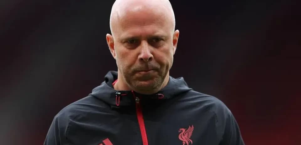 Liverpool coach walking on the pitch before match