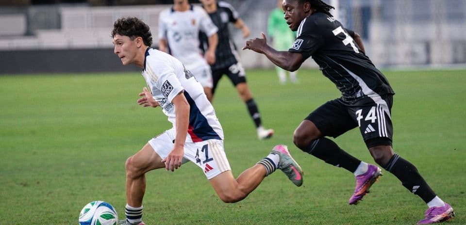 Player dribbling the ball during match action