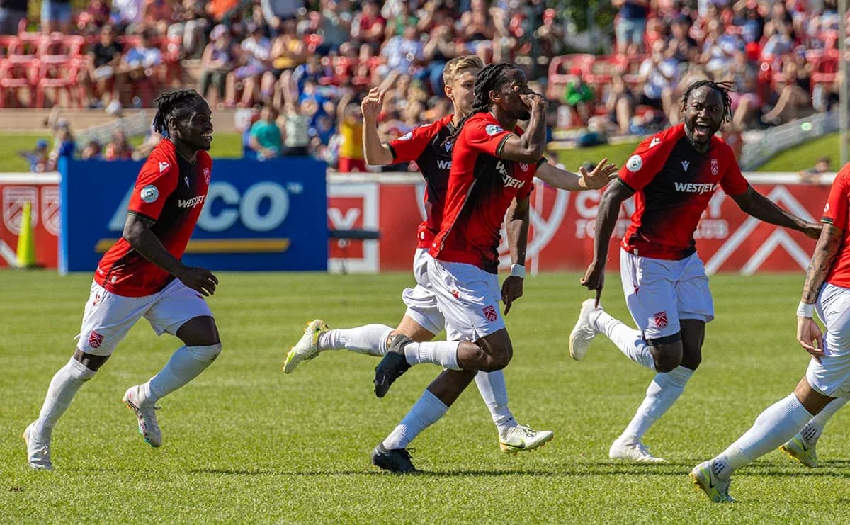 Players celebrating a goal during match
