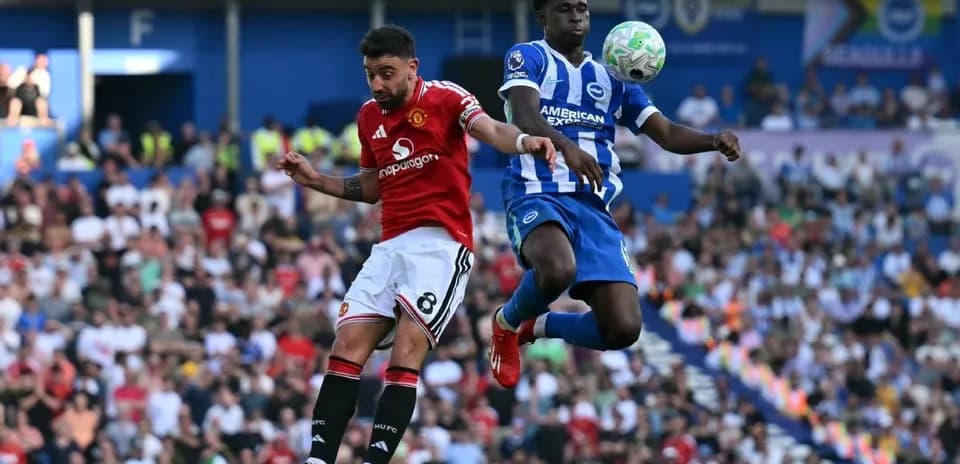 Player from Manchester United and Brighton competing for the ball