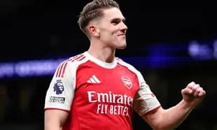 Player celebrating in Arsenal home kit