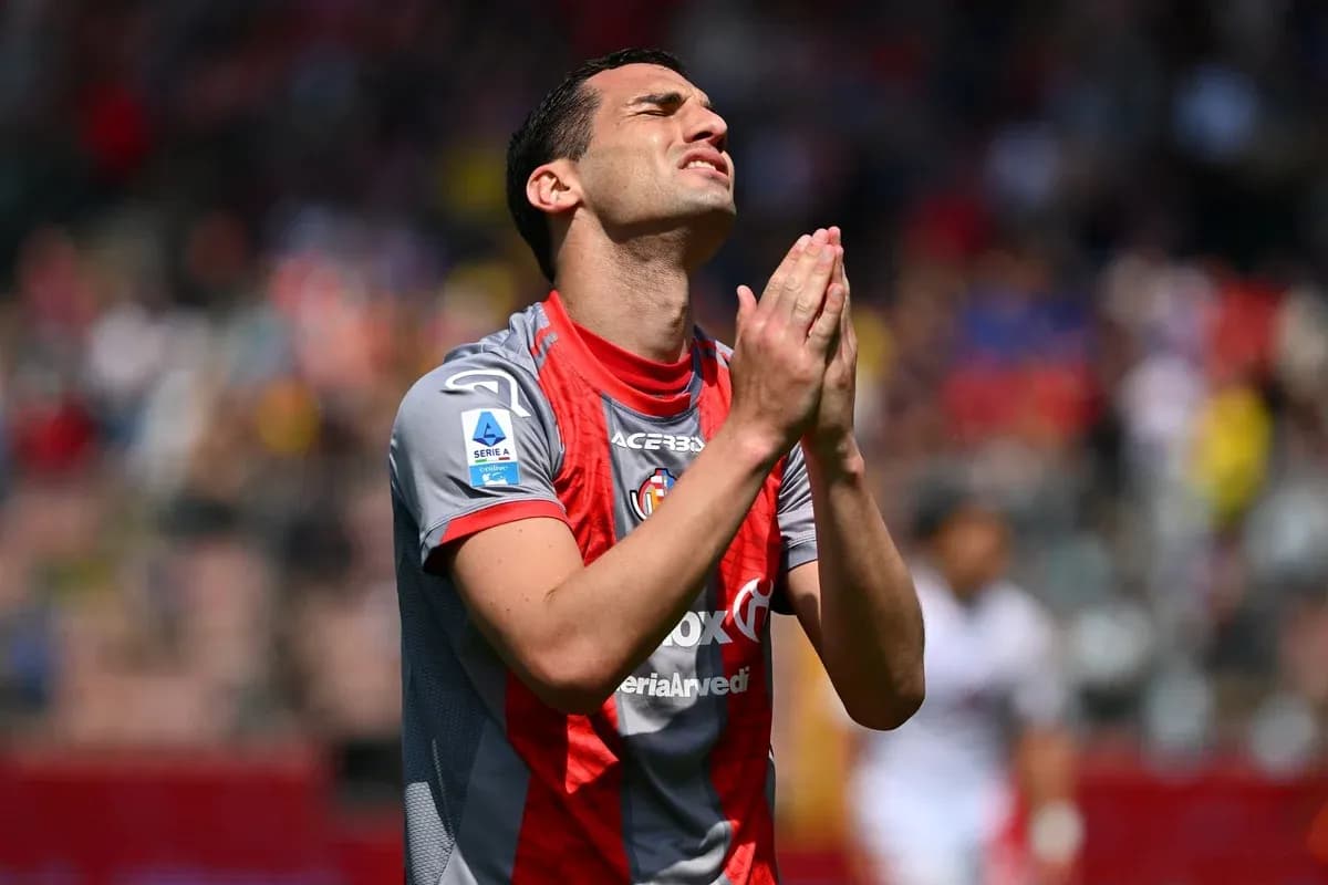 Player with hands clasped in front of face