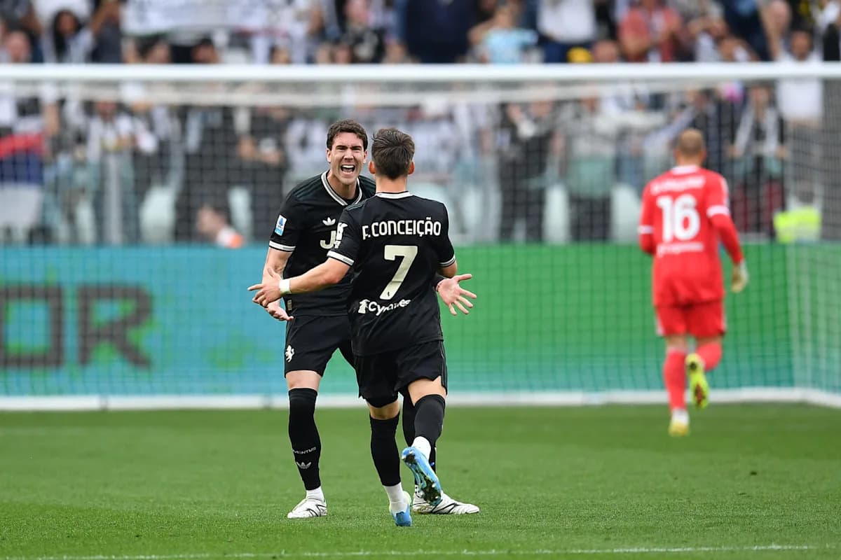 Two players celebrating a goal on the field