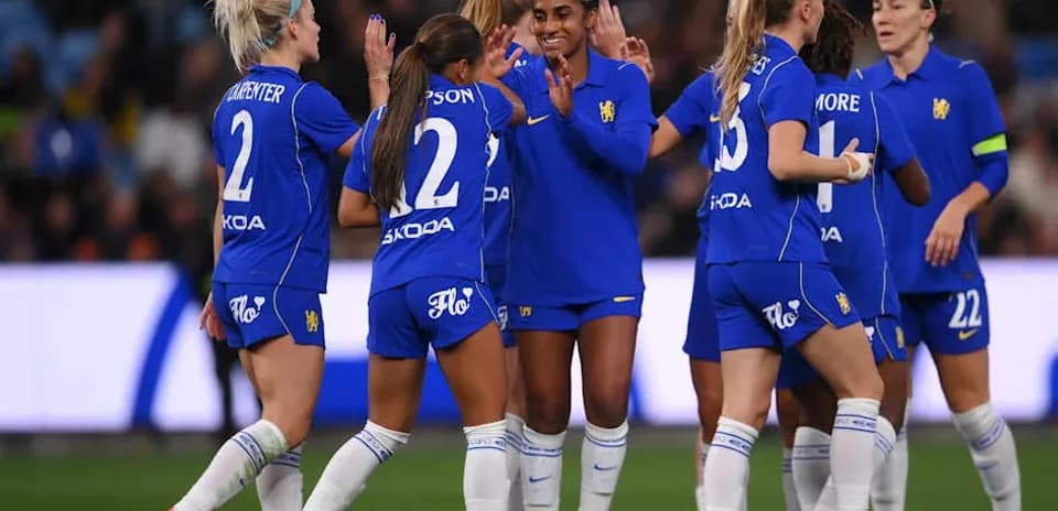 Team celebrating after scoring a goal during match