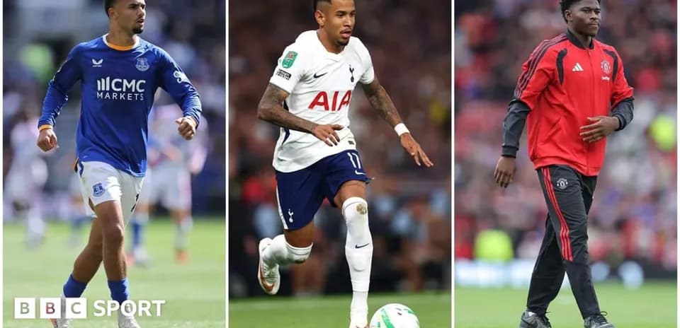 Three football players in club kits during match