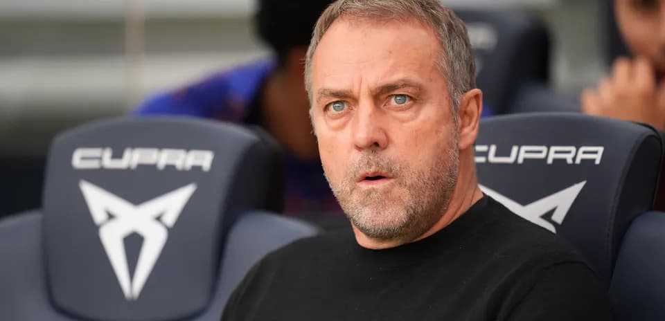 Coach sitting on bench during match