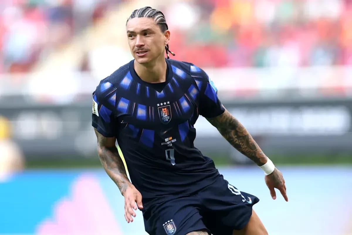Player in blue kit running on the pitch