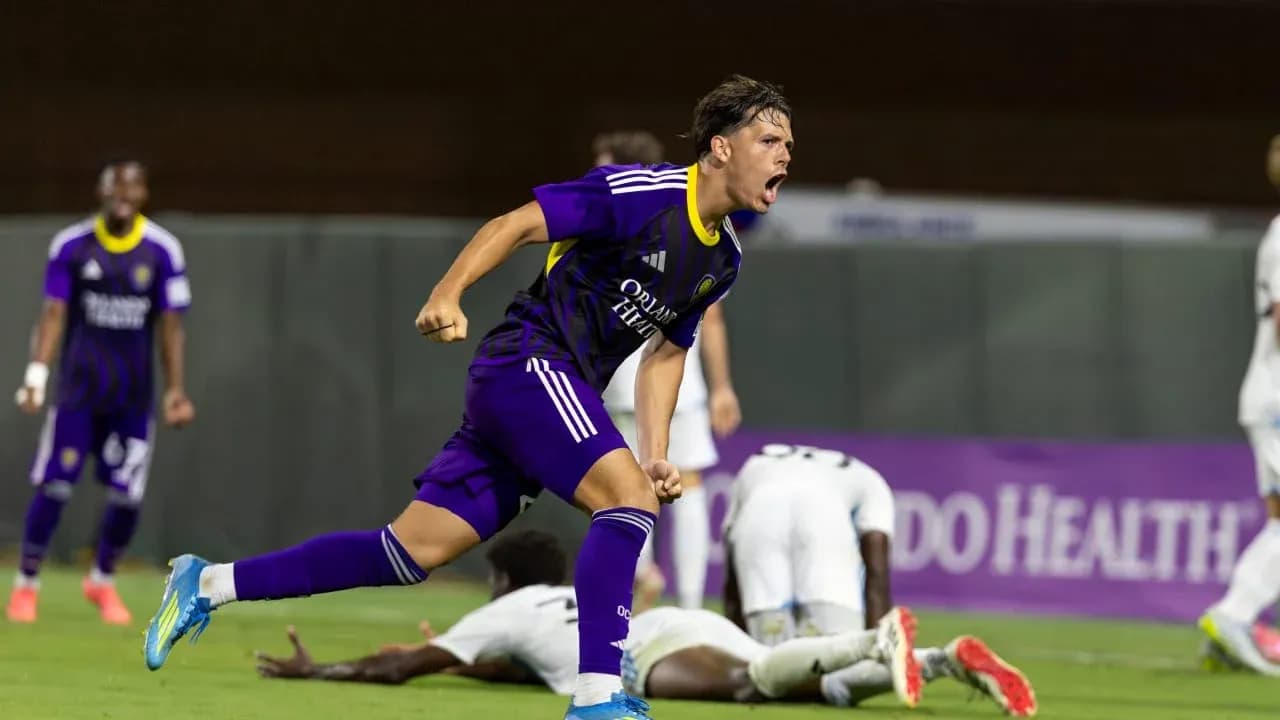 Player celebrating a goal during Crown Legacy match
