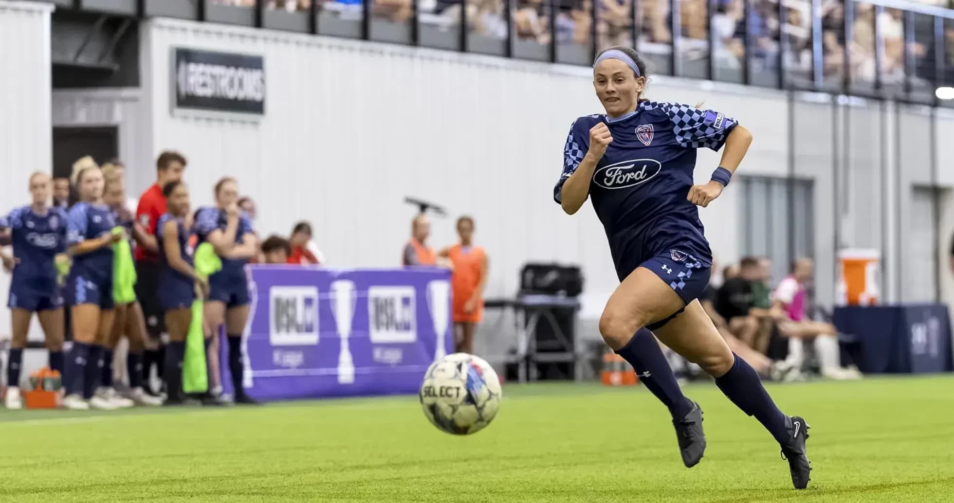 Player running with ball during match