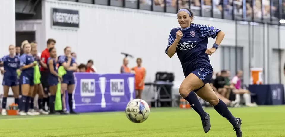 Player running with ball during match