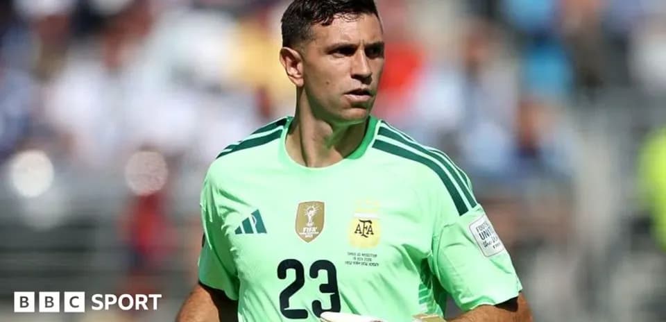 Goalkeeper in green jersey preparing for match