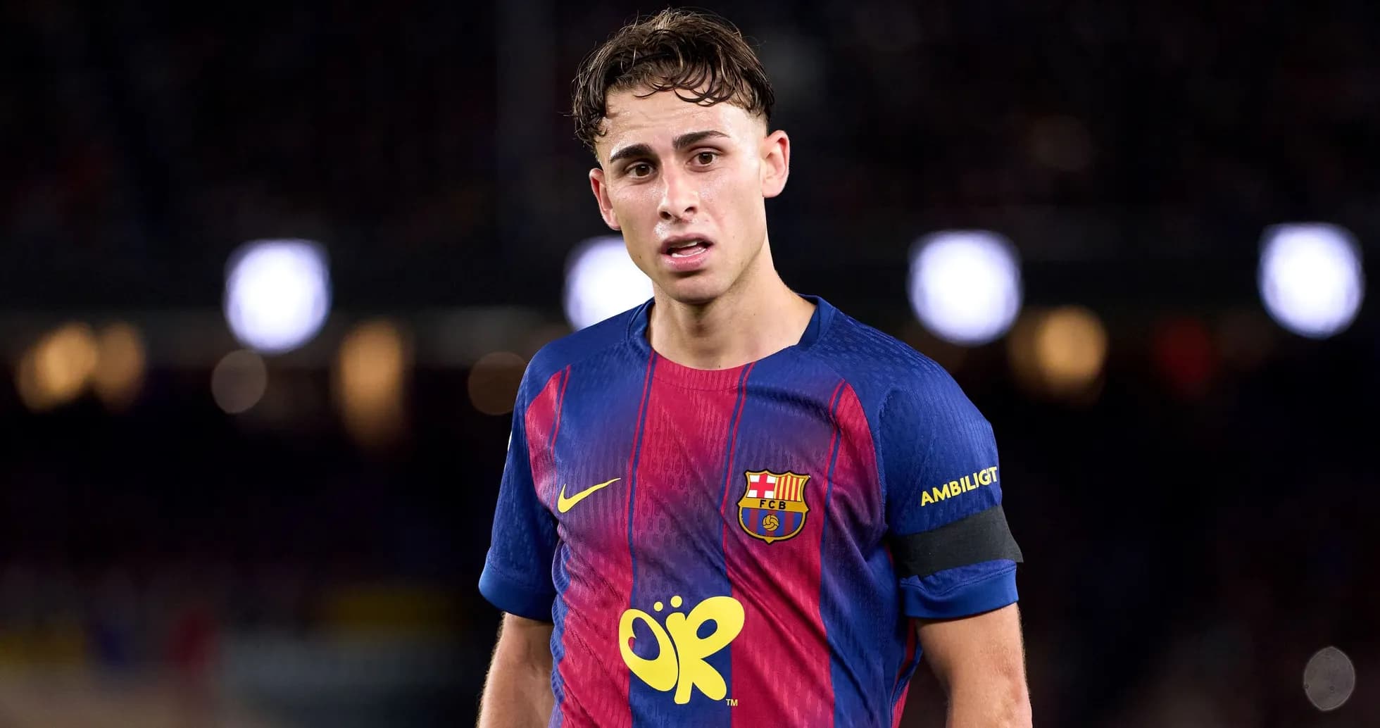 Barcelona player wearing captain's armband on pitch