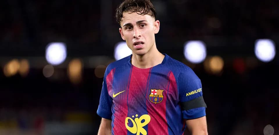 Barcelona player wearing captain's armband on pitch