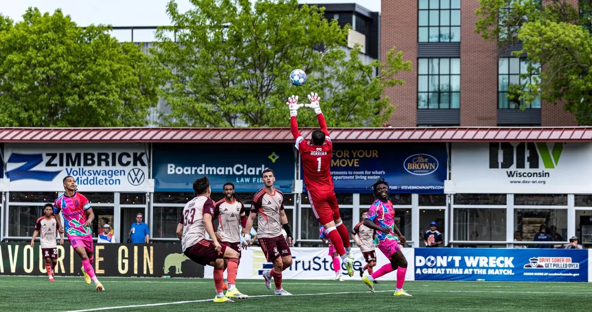 Goalkeeper making a save during football match