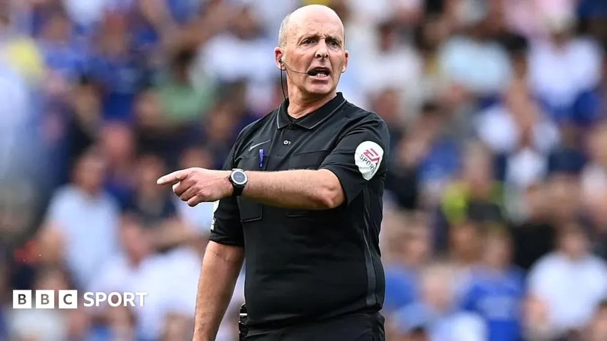 Referee signaling during a football match