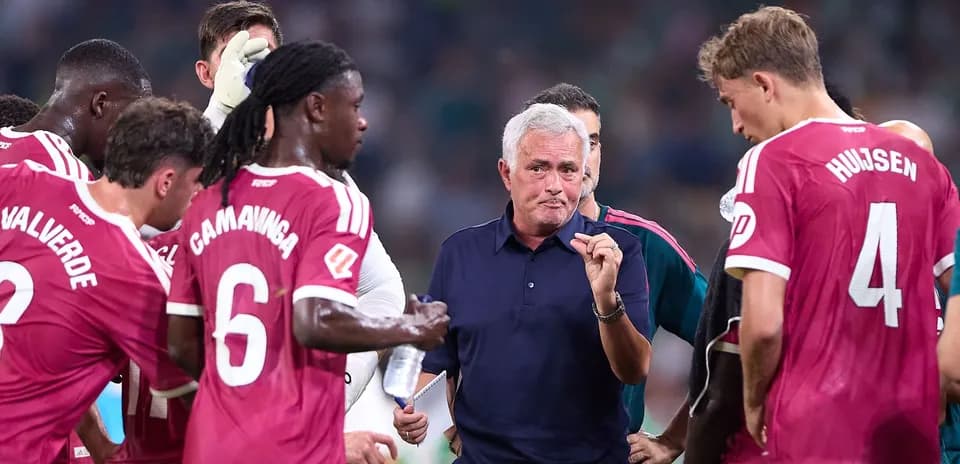 Manager discussing strategy with players during match