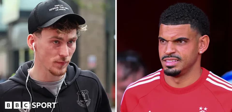 Two football players in casual attire, one listening to headphones