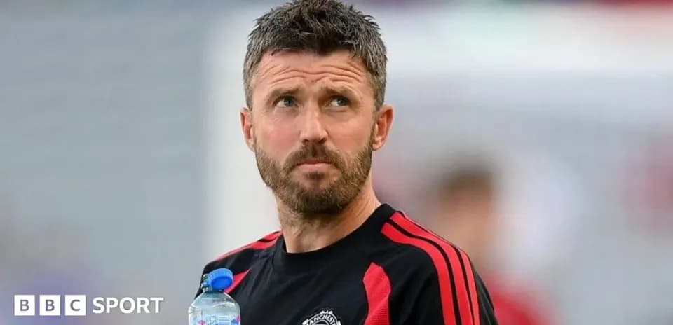 Coach holding water bottle during training session