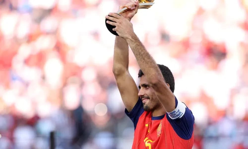 Player celebrating with trophy in stadium