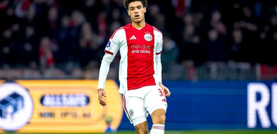 Player in Ajax kit walking on the pitch