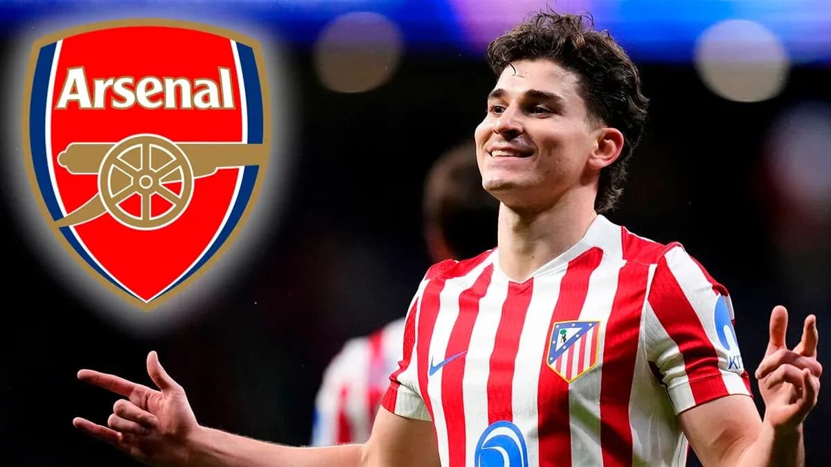 Atletico Madrid player celebrating with Arsenal logo