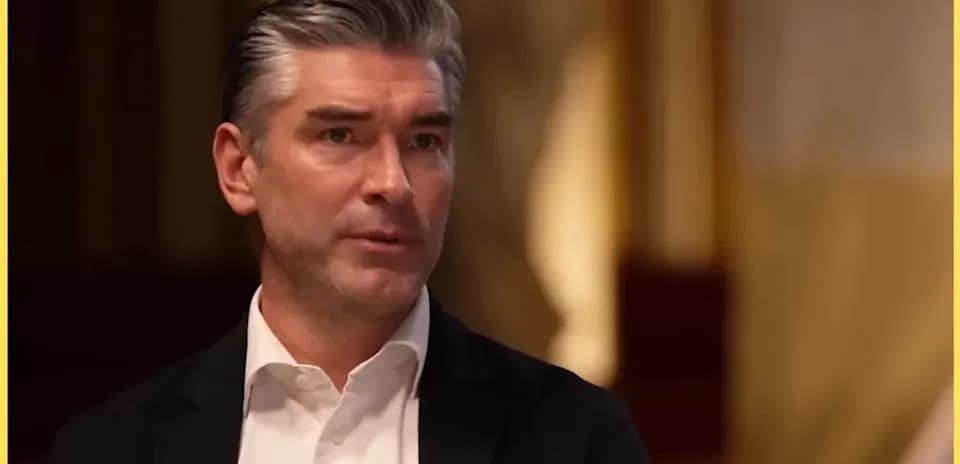 Man speaking during an interview indoors