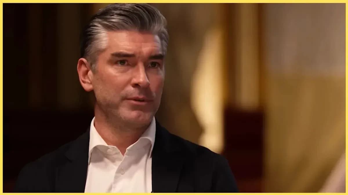 Man speaking during an interview indoors
