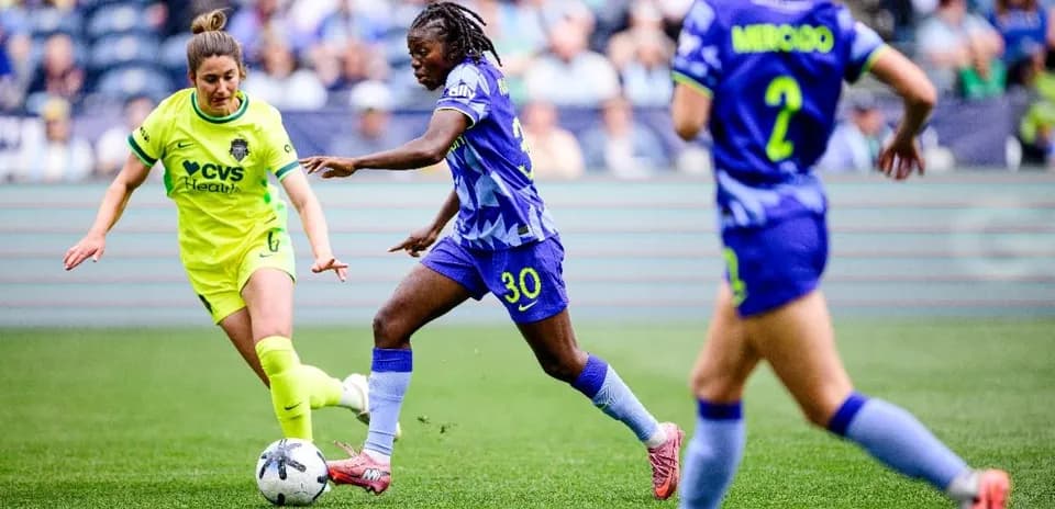 Two players competing for the ball during match