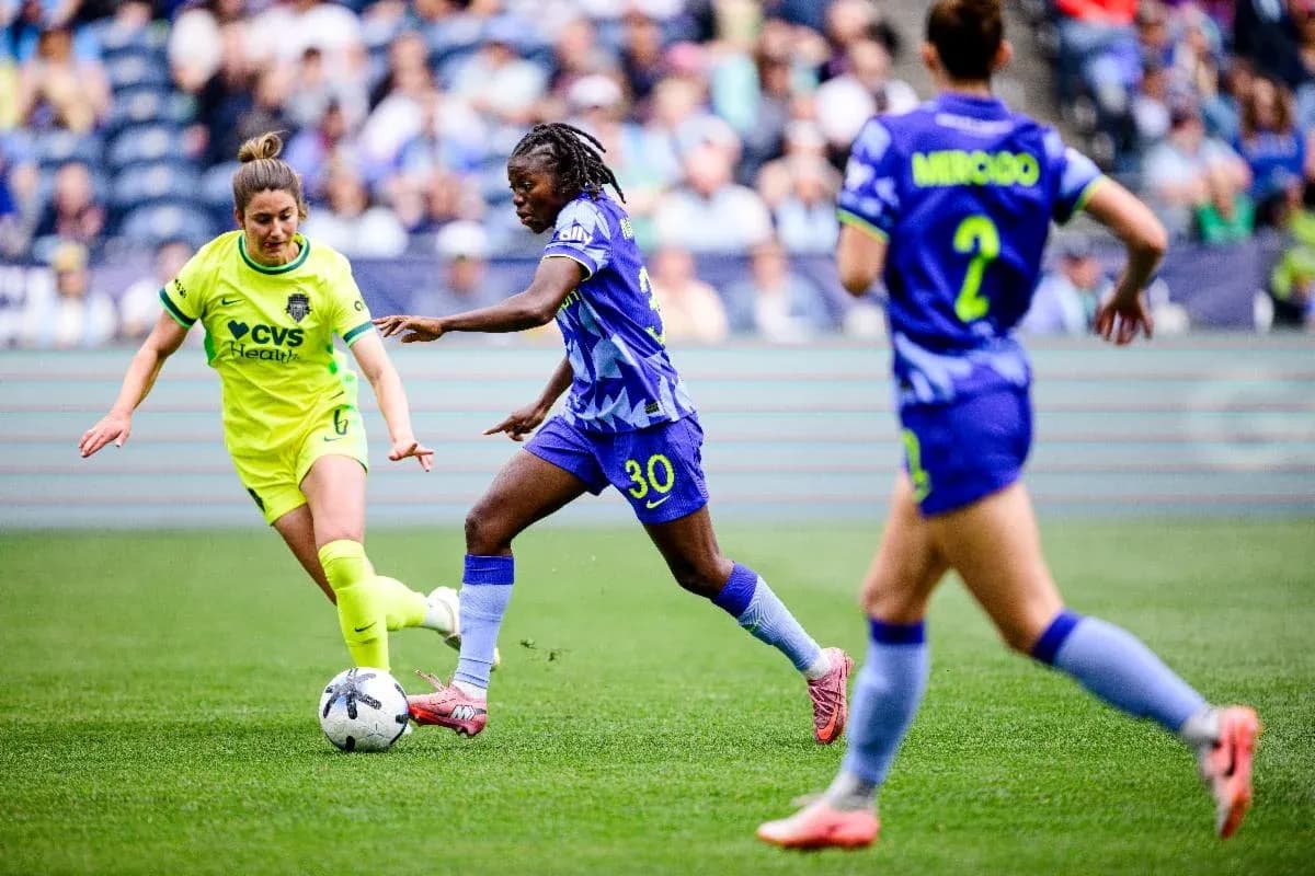 Two players competing for the ball during match