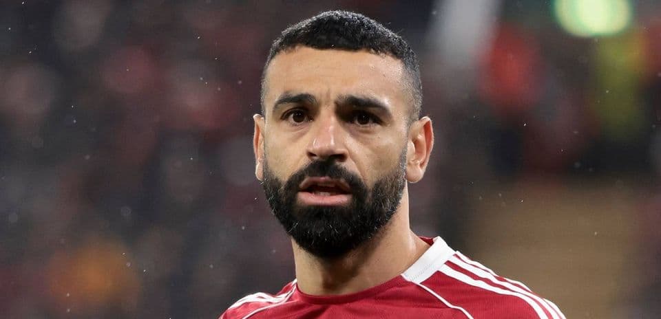 Player with beard wearing red jersey during match