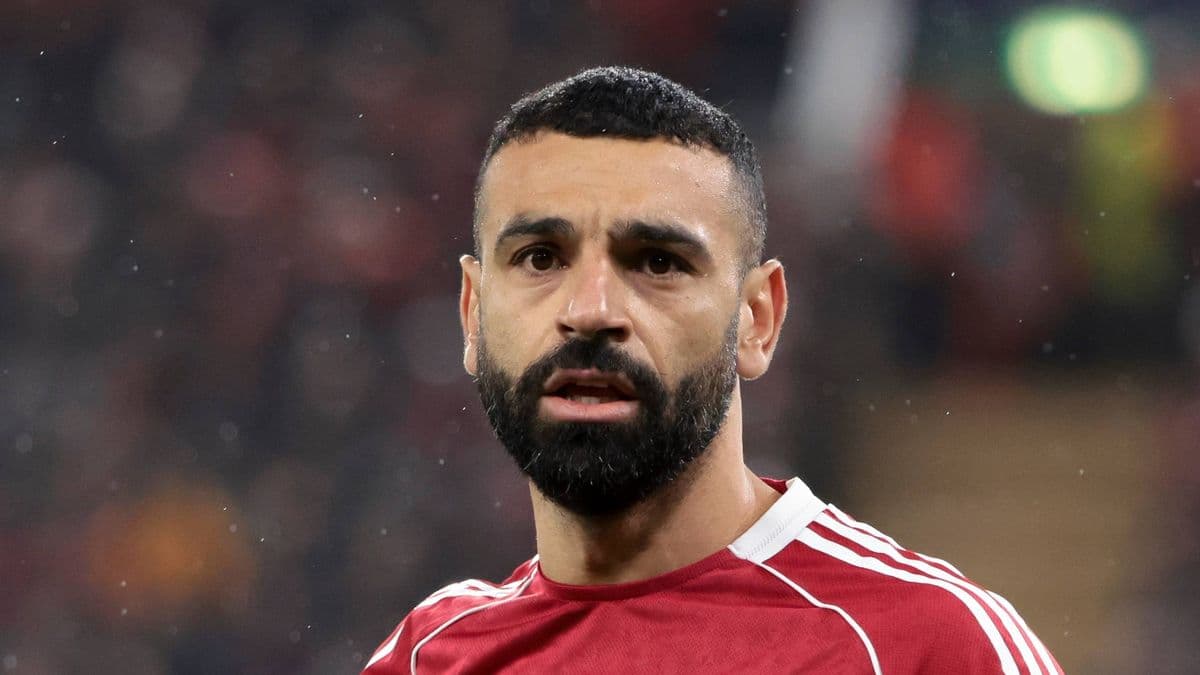 Player with beard wearing red jersey during match