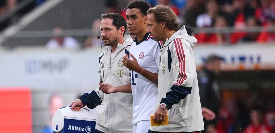 Player being assisted by staff during match