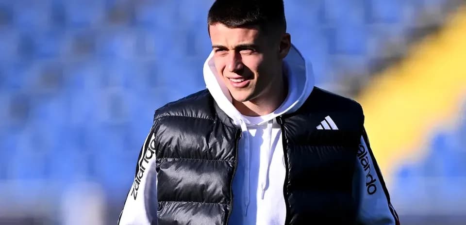 Player in a puffer vest at stadium