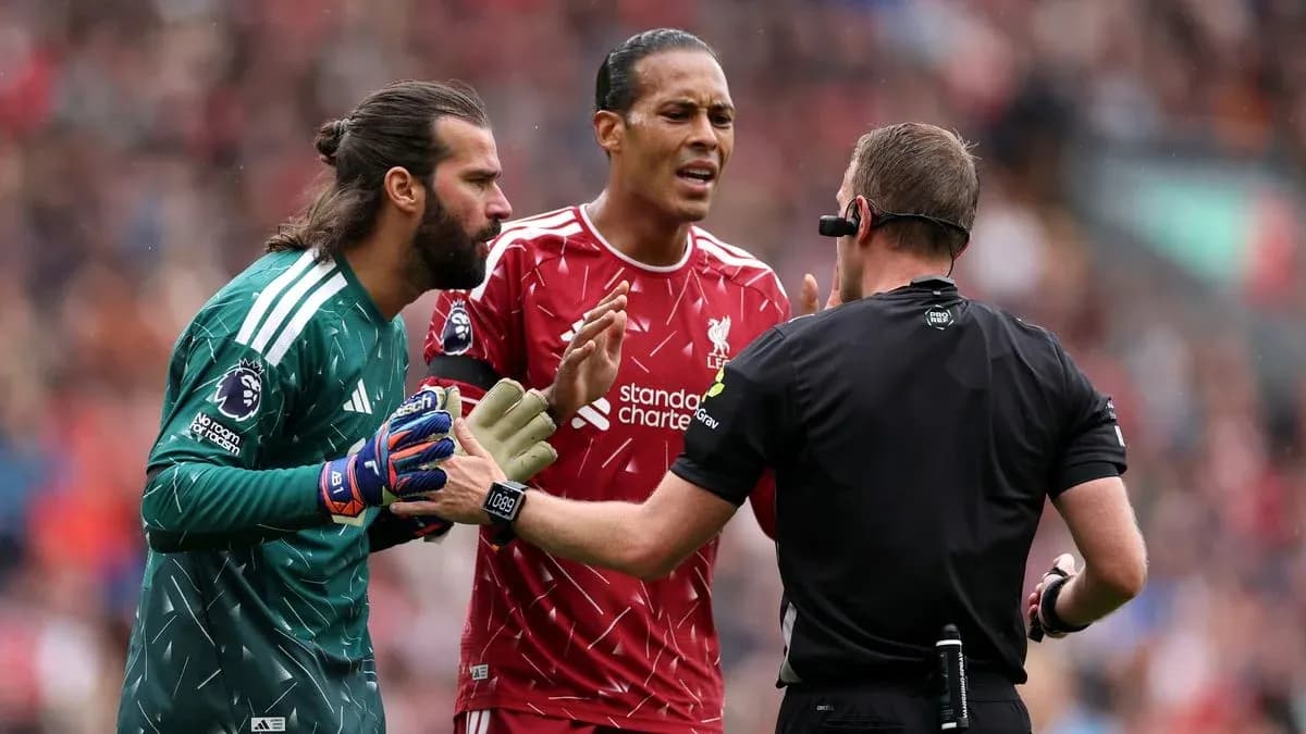 Liverpool players arguing with referee during match