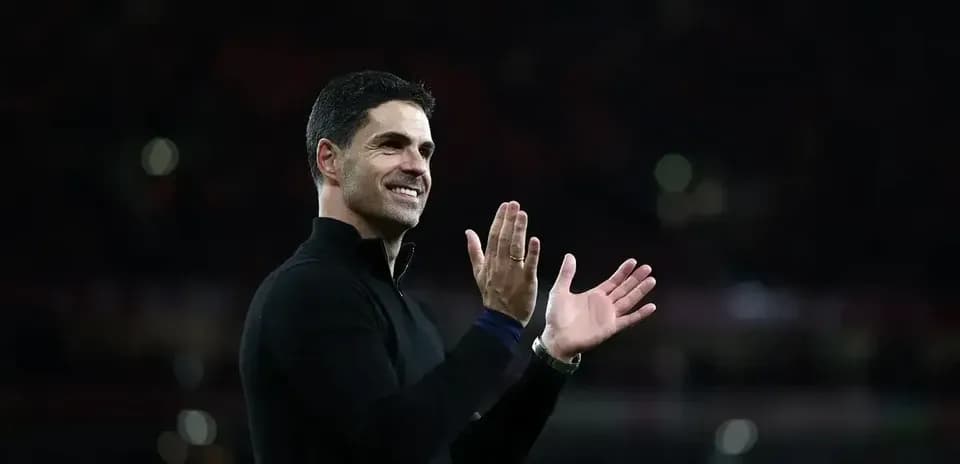Manager applauding fans after match conclusion