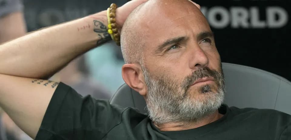 Coach sitting on the bench during a match